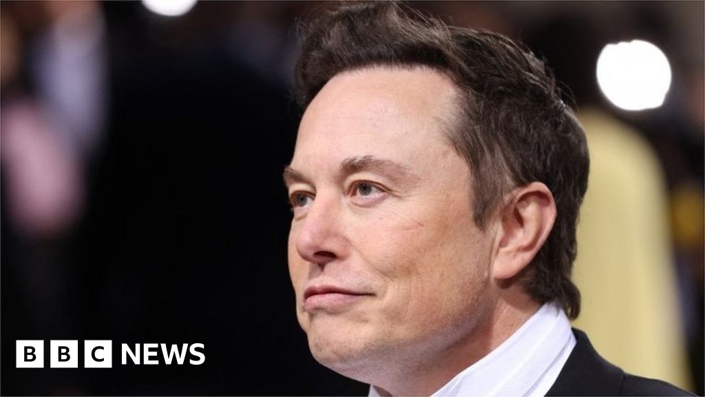 Musk says Twitter deal is 'temporarily on hold' over spam accounts